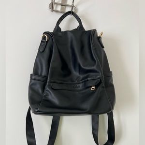 Cluci purse backpack - black and gold